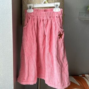 The campamento pink corduroy skirt with starfish